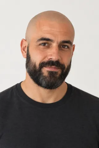 Frontal portrait of a fictional bald, bearded man about 45