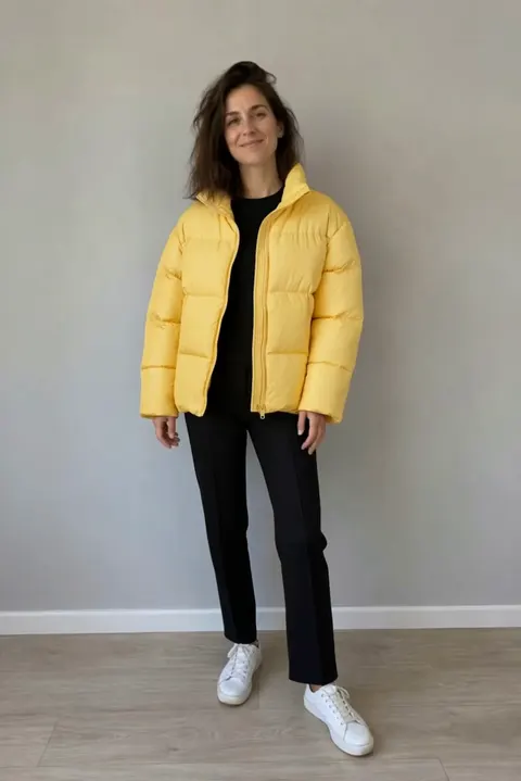 Actual Aisma result: The same turn in a canary-yellow puffer jacket and black pants.